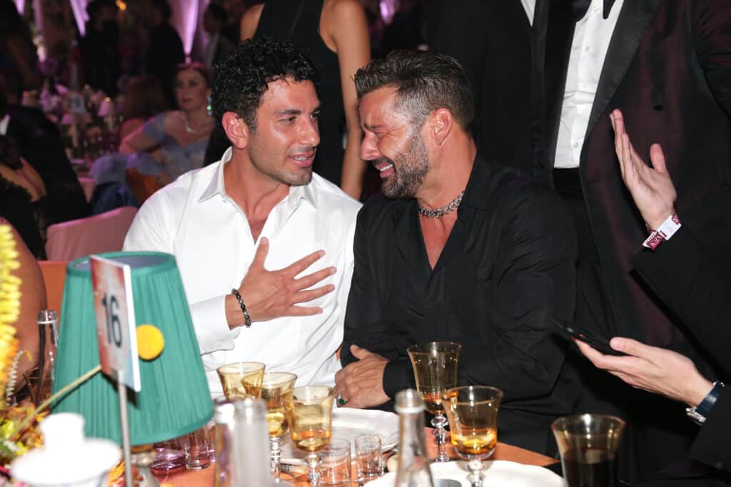 Jwan Yosef and Ricky Martin attend the amfAR Cannes Gala 2022 at Hotel du Cap-Eden-Roc on May 26, 2022 in Cap d'Antibes, France.