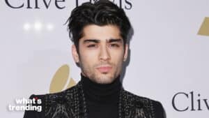 Zayn Malik wearing a black turtleneck and embellished jacket at a Clive Davis event