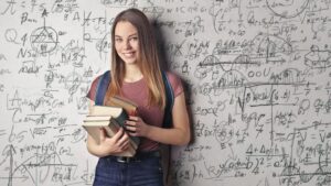 A young girl stands in front of a whiteboard filled with equations. Girl Math, TikTok, Creators