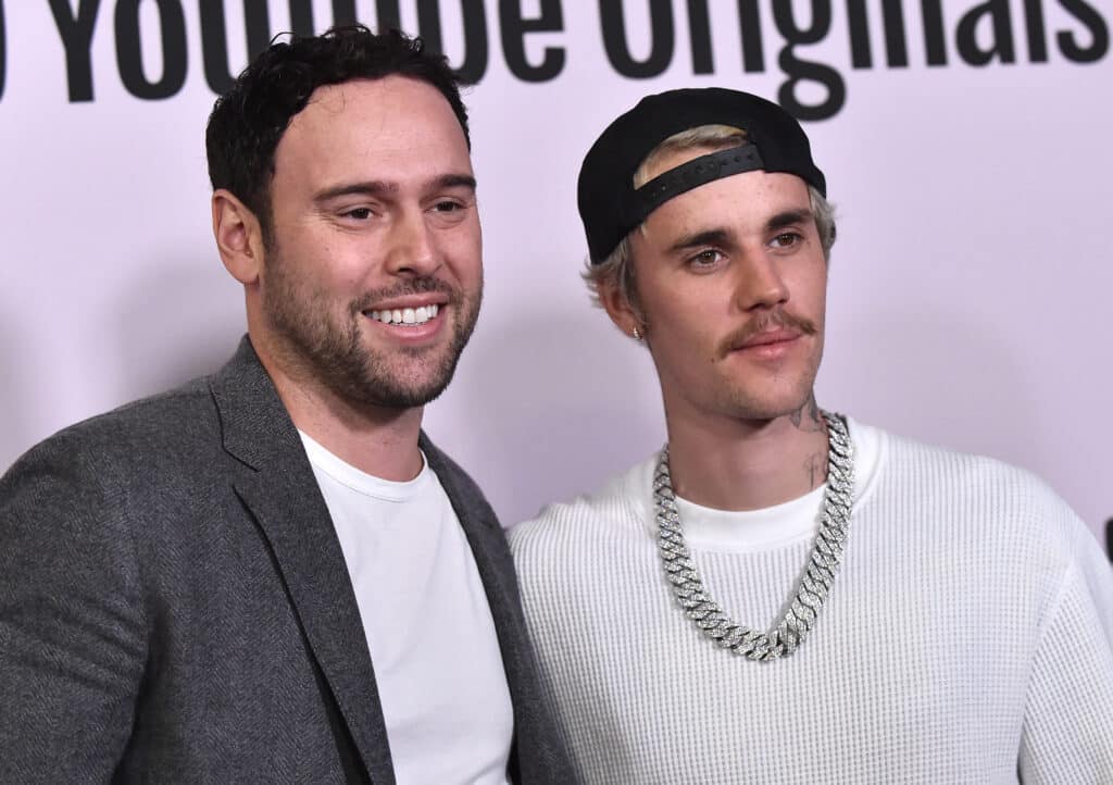 US businessman Scooter Braun (L) and Canadian singer Justin Bieber arrive for YouTube Originals' "Justin Bieber: Seasons" premiere at the Regency Bruin Theatre in Los Angeles on January 27, 2020.