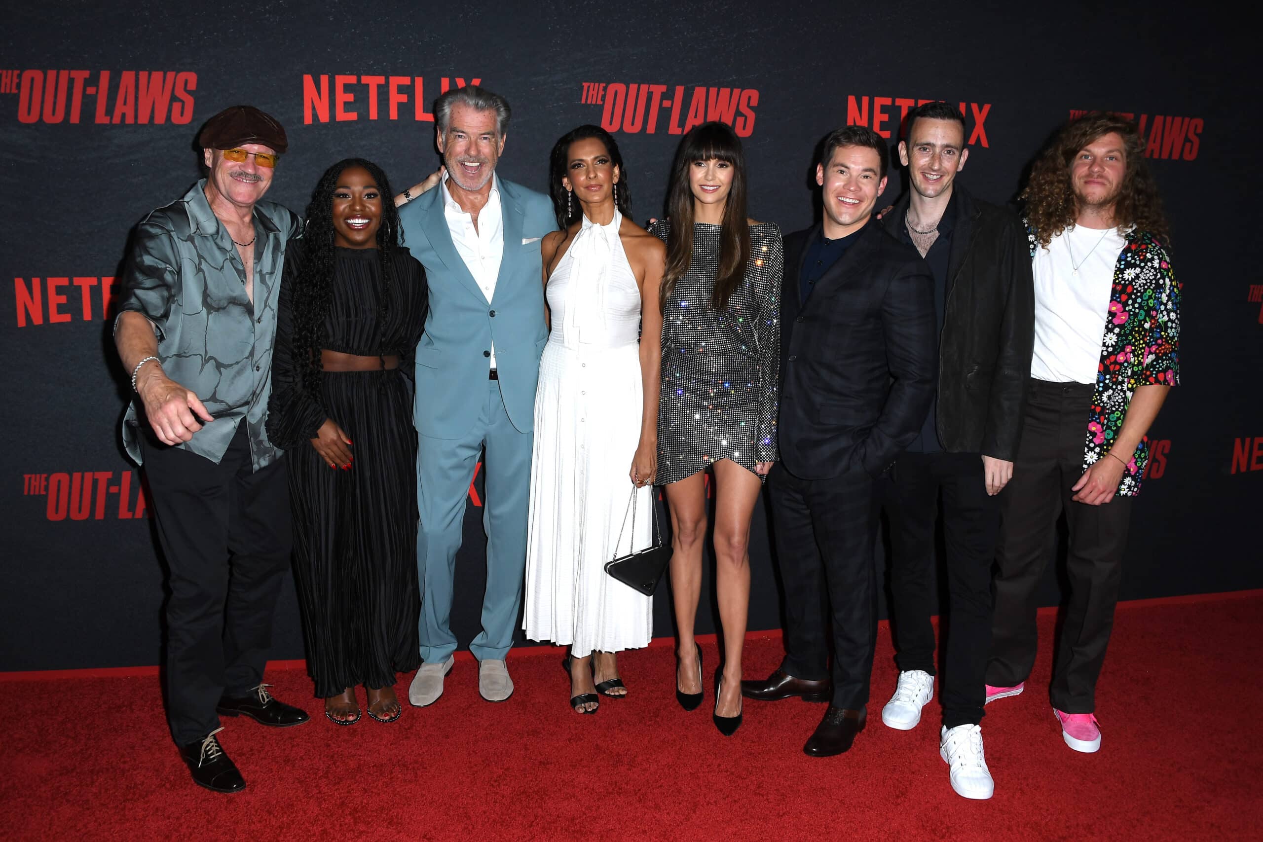 LOS ANGELES, CALIFORNIA - JUNE 26: Michael Rooker, Laci Mosley, Pierce Brosnan, Poorna Jagannathan, Nina Dobrev, Adam DeVine, Tyler Spindel and Blake Anderson arrives at the Los Angeles Premiere Of Netflix's "The Out-Laws" at Regal LA Live on June 26, 2023 in Los Angeles, California. 