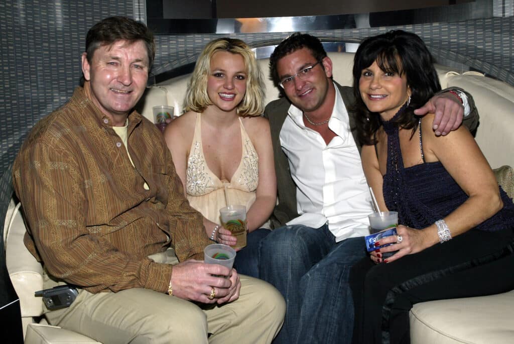 Singer Britney Spears (2nd,L) and family (L-R), father Jamie, brother Bryan and mother Lynne celebrate with Jamie Spears's partners (not shown) George and Phil Maloof and John Decastro, at the launch party for their new Palms Home Poker Host software held at the one of a kind Hardwood Suite at the Palms Casino Resort in Las Vegas. 