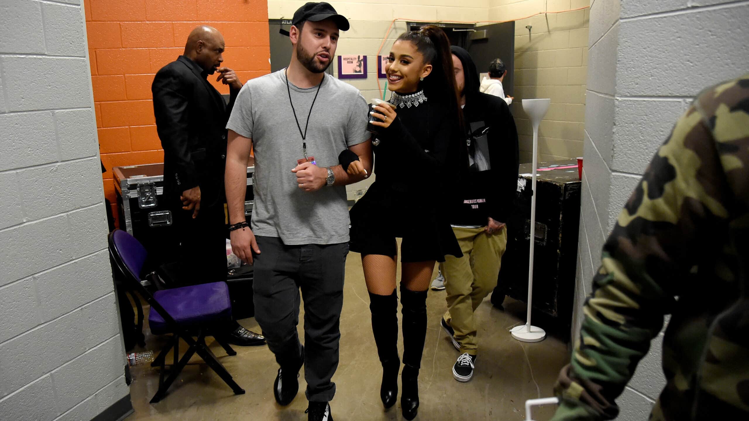 PHOENIX, AZ - FEBRUARY 03: (EXCLUSIVE COVERAGE) Scooter Braun (L) and Ariana Grande walk backstage during the "Dangerous Woman" Tour Opener at Talking Stick Resort Arena on February 3, 2017 in Phoenix, Arizona.