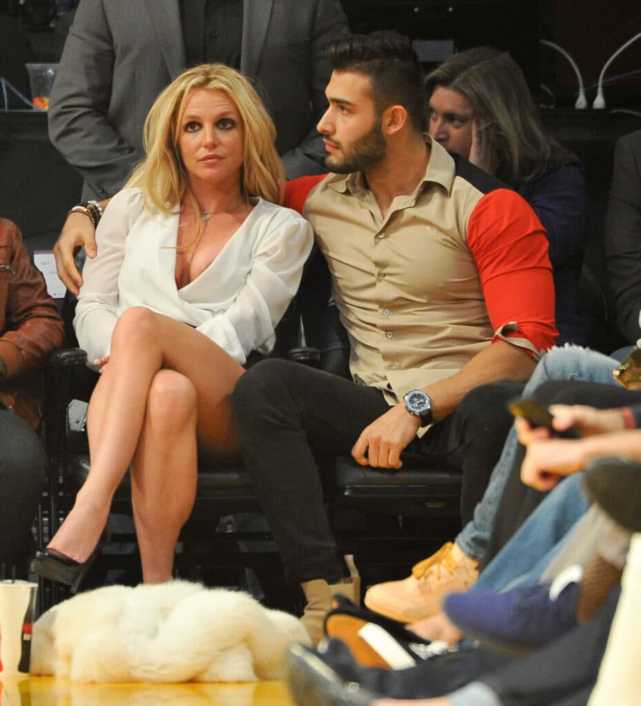 Britney Spears and Sam Asghari attend a basketball game between the Los Angeles Lakers and the Golden State Warriors at Staples Center on November 29, 2017 in Los Angeles, California.