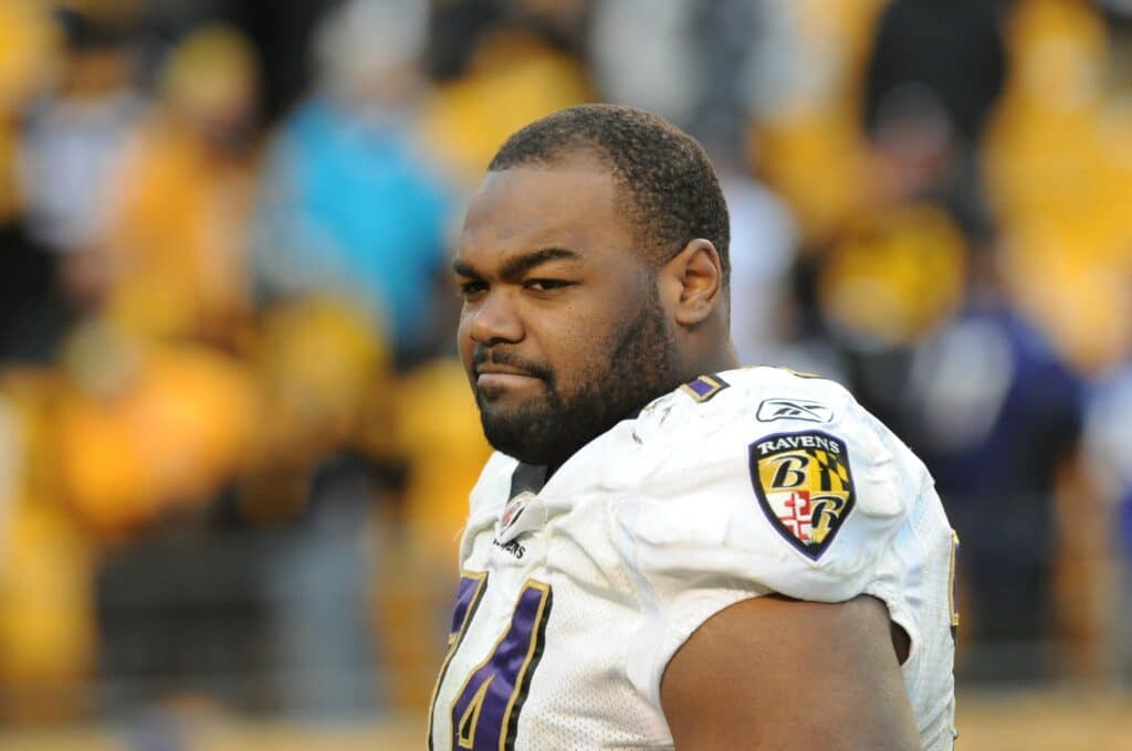 Offensive lineman Michael Oher #74 of the Baltimore Ravens looks on from the field after a game against the Pittsburgh Steelers at Heinz Field on December 27, 2009 in Pittsburgh, Pennsylvania. The Steelers defeated the Ravens 23-20.