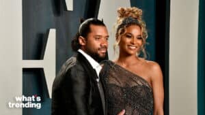 Russell Wilson and Ciara posing together at a formal event with "what's trending" logo.