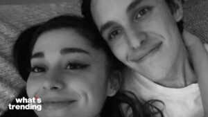 Ariana Grande and Dalton Gomez smiling closely in a black and white selfie with "what's trending" text.