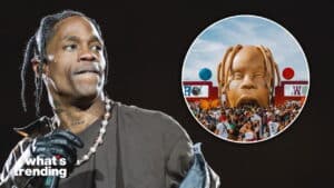 Rapper Travis Scott performing with a crowd at his Astroworld Festival featuring a giant inflatable head stage design.