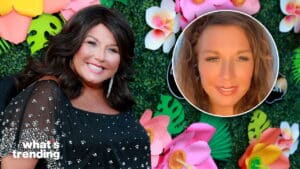 Abby Lee Miller smiling in a black dress with pearl embellishments against a floral backdrop with an inset of a woman with curly hair