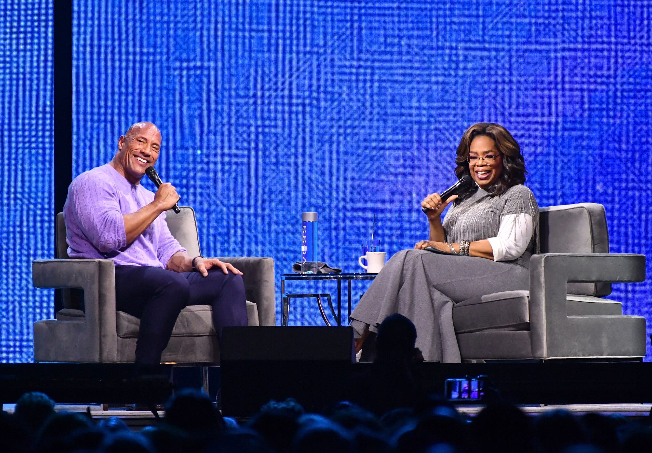 ATLANTA, GEORGIA - JANUARY 25: (EXCLUSIVE COVERAGE) Dwayne Johnson and Oprah Winfrey onstage during Oprah's 2020 Vision: Your Life in Focus Tour presented by WW