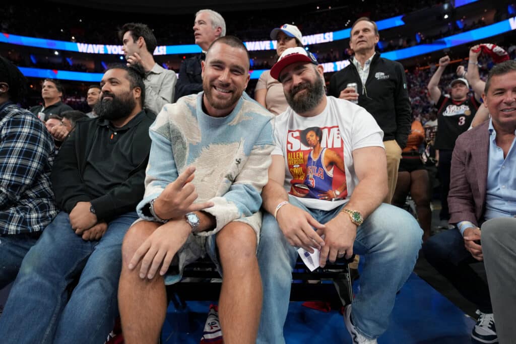 Travis Kelce and Jason Kelce attend a game before the game against the Boston Celtics against the Philadelphia 76ers during Game 6 of the 2023 NBA Playoffs Eastern Conference semi-finals on May 11, 2023 at the Wells Fargo Center in Philadelphia, Pennsylvania