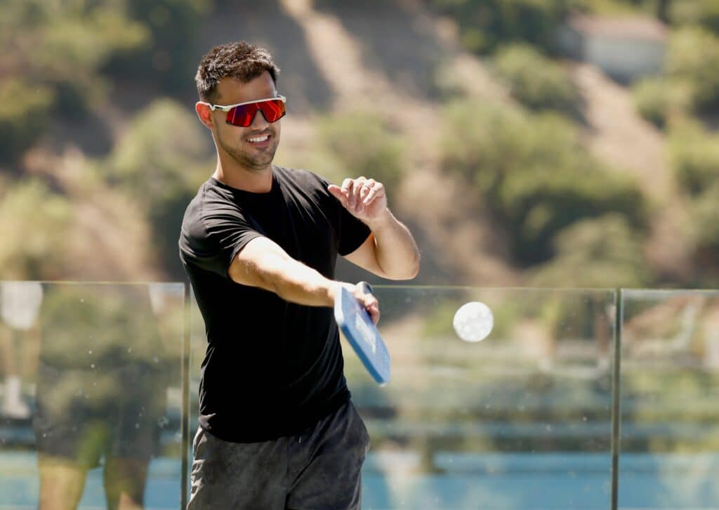 Taylor Lautner plays in the CELSIUS pickleball tournament at David Dobrik’s home.