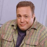 Promotional portrait of American actor and comedian Kevin James in costume as the charcter Doug Heffernan as he poses with his hands in his pockets on the set of the television sitcom 'The King of Queens,' late 1990s.