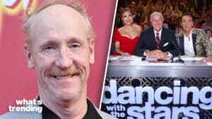 Close-up of actor Bradley Whitford smiling next to Dancing with the Stars judges Carrie Ann Inaba, Len Goodman, and Bruno Tonioli at the judging panel.