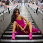 TikTok's 'Tube Girl,' aka Sabrina Bahsoon, poses on the steps of a London Tube station.