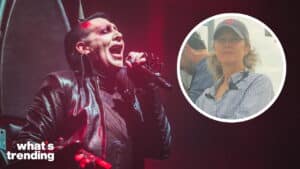Marilyn Manson performing on stage with inset of a woman wearing a Boston Red Sox cap outdoors