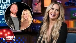 Kim Zolciak smiling on a talk show set with an inset photo of her and a man in a leather jacket and mesh top