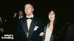 Cher and her son Chaz Bono dressed formally at a nighttime event