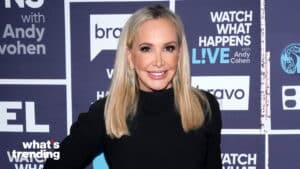 Shannon Beador smiling at Watch What Happens Live with Andy Cohen event backdrop