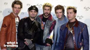 Backstreet Boys posing with an American Music Award at the American Music Awards event.