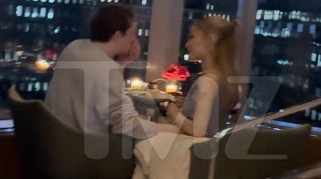 Ethan Slater and Ariana Grande having dinner from photos obtained from TMZ.