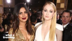 Priyanka Chopra and Sophie Turner posing at the Golden Globe Awards red carpet event.