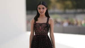 PARIS, FRANCE - SEPTEMBER 26: Rachel Zegler is seen outside Dior show wearing crystal Dior earrings and a black see through Dior dress with red embroided butterfly details during the Womenswear Spring/Summer 2024 as part of Paris Fashion Week on September 26, 2023 in Paris, France.