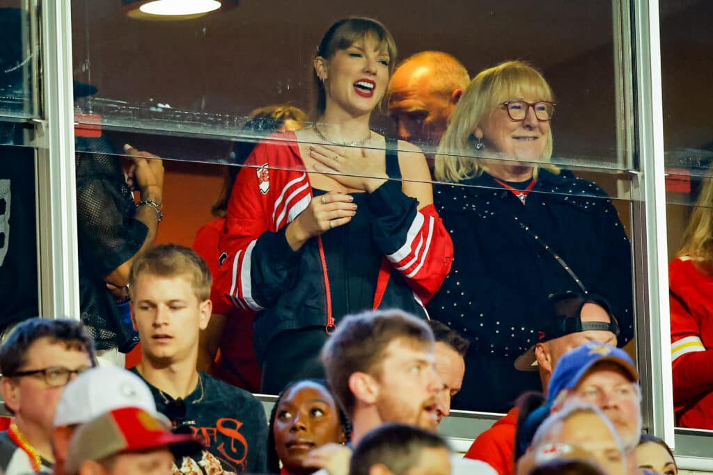 KANSAS CITY, MISSOURI - OCTOBER 12: Taylor Swift and Donna Kelce react before the game between the Kansas City Chiefs and the Denver Broncos at GEHA Field at Arrowhead Stadium on October 12, 2023 in Kansas City, Missouri.
