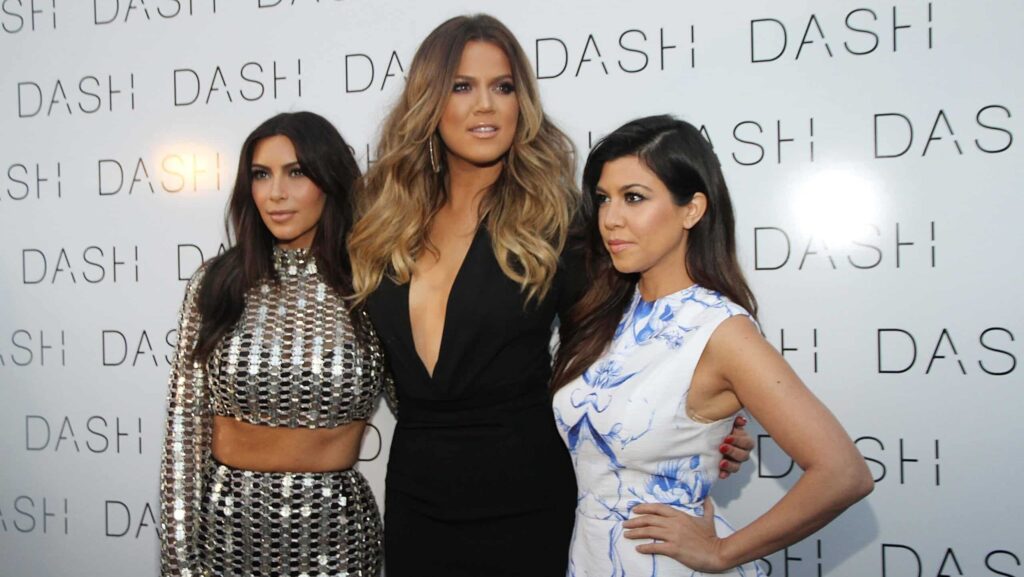 Kim Kardashian, Khloe Kardashian and Kourtney Kardashian attends the grand opening of DASH Miami Beach at Dash Miami Beach on March 12, 2014 in Miami Beach, Florida.