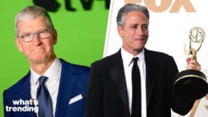 Tim Cook in a blue suit and Jon Stewart holding an Emmy award in a black tuxedo.