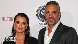 Kyle Richards and Mauricio Umansky posing at a What’s Trending event with Neuro drink branding in the background