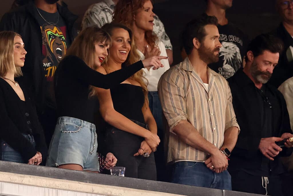 Singer Taylor Swift and Actor Ryan Reynolds look on prior to the game between the Kansas City Chiefs and the New York Jets at MetLife Stadium on October 01, 2023 in East Rutherford, New Jersey.