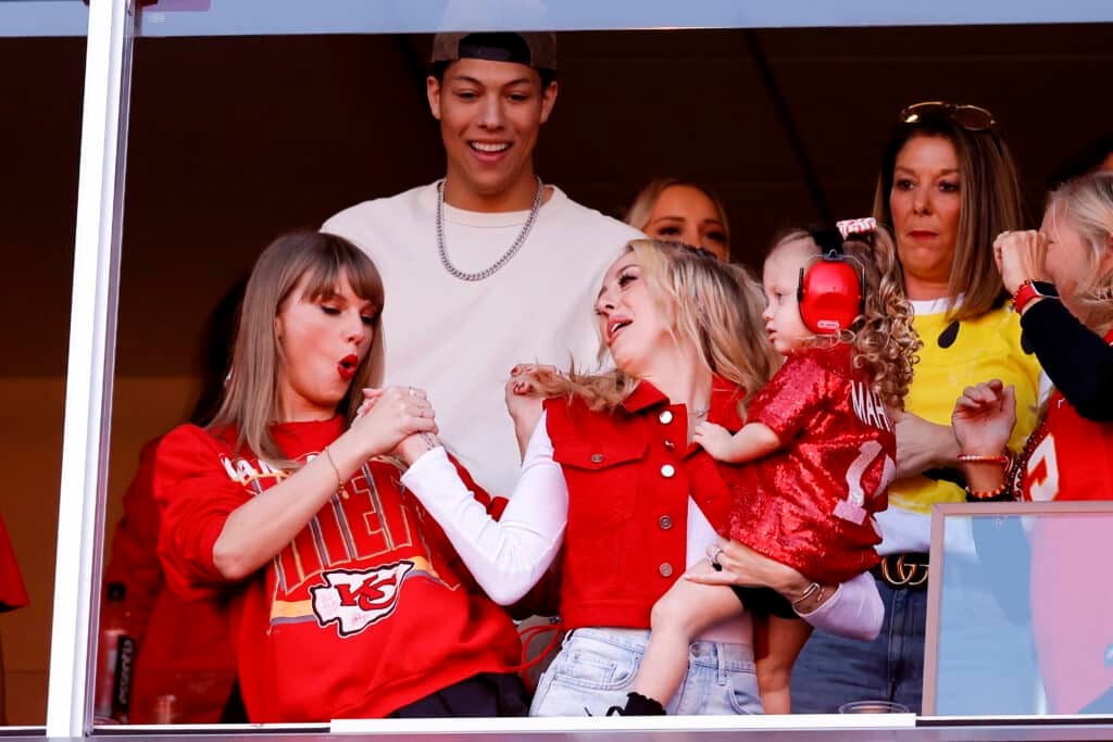 Taylor Swift and Brittany Mahomes celebrate a touchdown during the second quarter of the game between the Kansas City Chiefs and the Los Angeles Chargers at GEHA Field at Arrowhead Stadium on October 22, 2023 in Kansas City, Missouri.