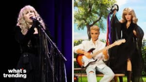 Stevie Nicks singing on stage next to Barbie dolls dressed as musicians with a guitar and tambourine outdoors