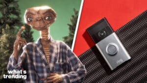 E.T. wearing a plaid robe pointing upward next to a Ring video doorbell on a red and black background.