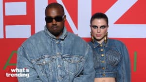 Kanye West and Julia Fox wearing denim outfits posing against a red backdrop with "what's trending" text.