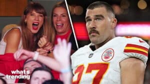 Taylor Swift and a fan cheering next to Kansas City Chiefs player Travis Kelce in uniform