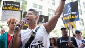 Wilson Cruz joins SAG-AFTRA members as they maintain picket lines in front of Netflix on August 18, 2023 in New York City. Members of SAG-AFTRA and WGA