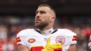 DENVER, COLORADO - OCTOBER 29: Travis Kelce #87 of the Kansas City Chiefs looks on during the national anthem prior to an NFL football game between the Denver Broncos and the Kansas City Chiefs at Empower Field At Mile High on October 29, 2023 in Denver, Colorado.