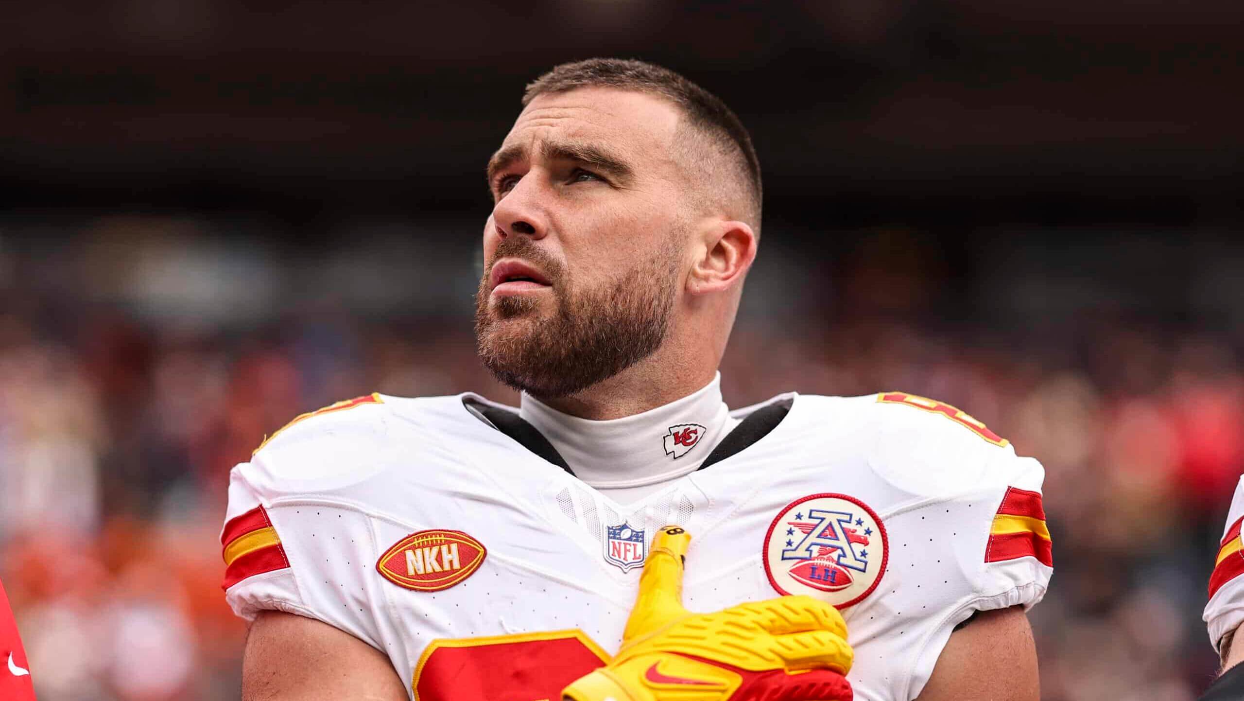 DENVER, COLORADO - OCTOBER 29: Travis Kelce #87 of the Kansas City Chiefs looks on during the national anthem prior to an NFL football game between the Denver Broncos and the Kansas City Chiefs at Empower Field At Mile High on October 29, 2023 in Denver, Colorado.