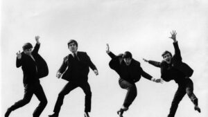 Photo of the Beatles, April 1963; L-R: Ringo Starr, George Harrison, Paul McCartney, John Lennon - posed, group shot - jumping on wall, Used on the Twist & Shout EP cover