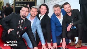 Backstreet Boys placing hands on their Hollywood Walk of Fame star during ceremony