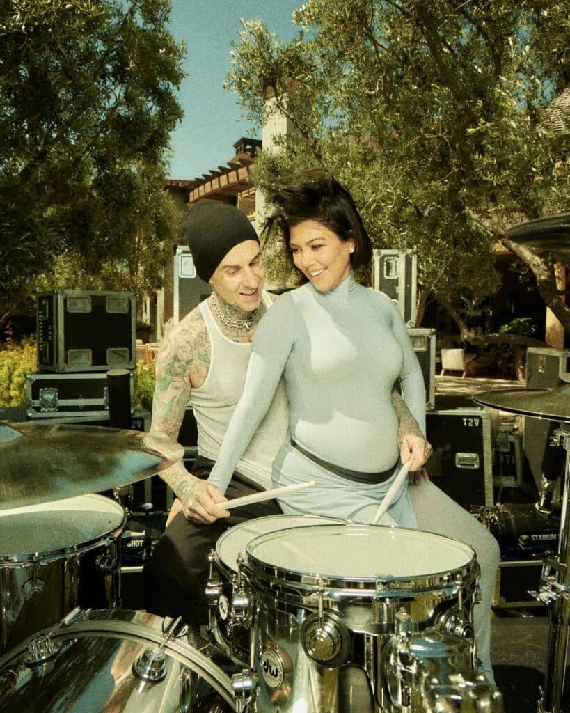 Pregnant Kourtney Kardashian drums alongside husband Travis Barker.