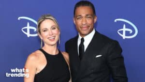 Don Lemon and his wife Cheryl Ford smiling at a Disney event with a blue backdrop.