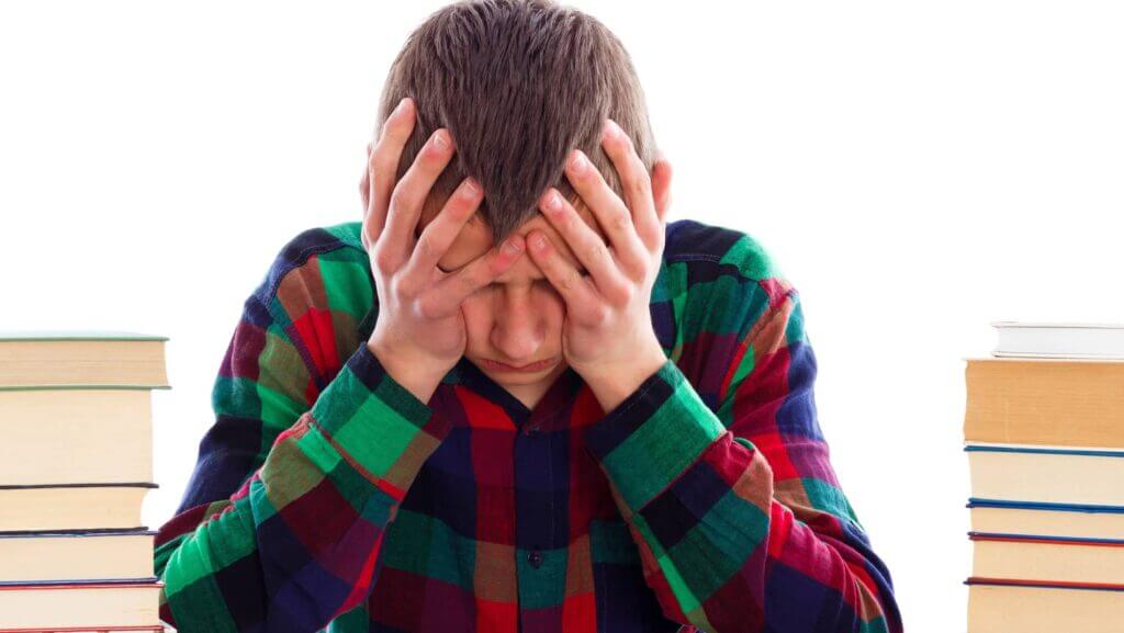 Young student without inspiration uncapable to write his essay.