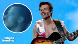 Harry Styles smiling and playing guitar on stage with a blue background and "what's trending" text.