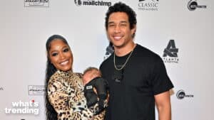 Keke Palmer and her partner holding their baby at the Atlanta Film Festival event.