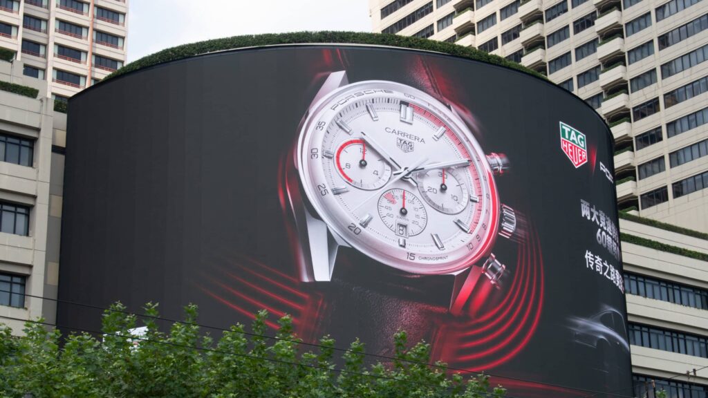 SHANGHAI, CHINA - SEPTEMBER 18, 2023 - An advertisement for Tag Heuer watches is seen on the wall of the mall in Shanghai, China, September 18, 2023.