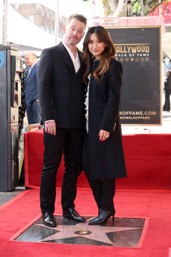 Macaulay Culkin and Brenda Song attend the ceremony honoring Macaulay Culkin with a Star on the Hollywood Walk of Fame on December 01, 2023 in Hollywood, California.
