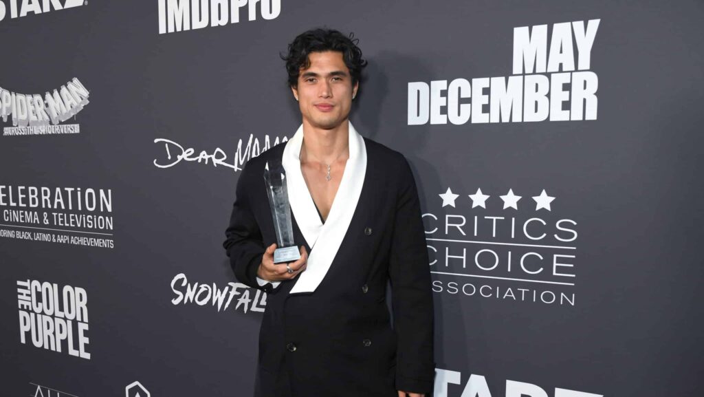 LOS ANGELES, CALIFORNIA - DECEMBER 04: Charles Melton poses with the Breakthrough Actor Award - Film during the Critics Choice Association's Celebration of Cinema & Television: Honoring Black, Latino and AAPI Achievements at Fairmont Century Plaza on December 04, 2023 in Los Angeles, California.
